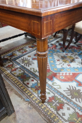 A reproduction square mahogany inlaid games table with chequer board surface, interior with baize and backgammon surfaces, width 91cm, height 78cm